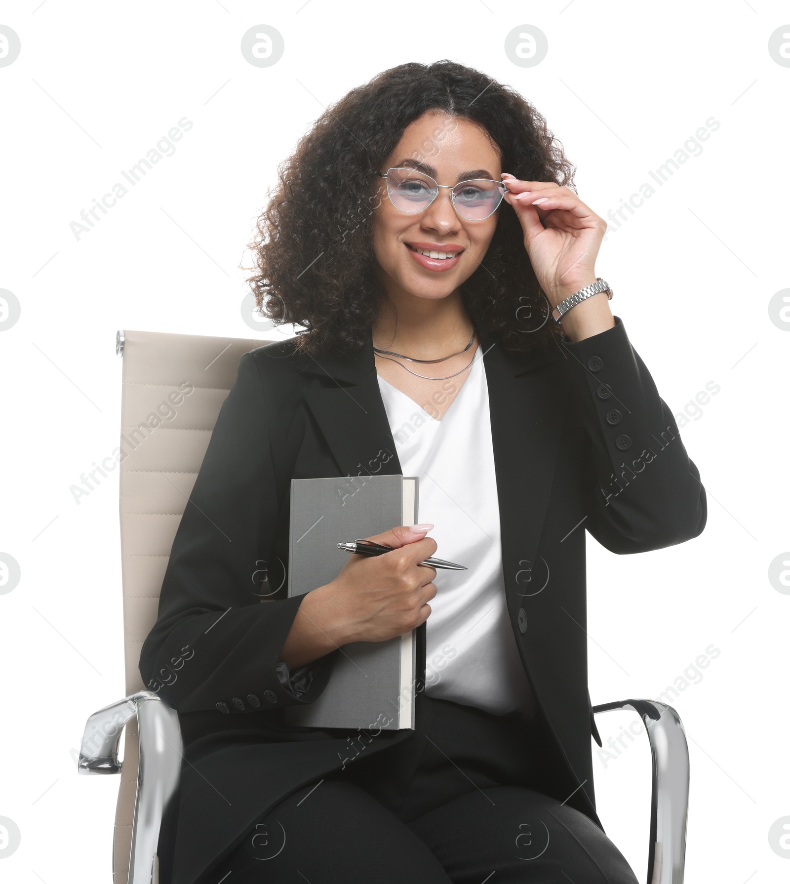 Professional psychologist with notebook and pen in office chair on white background Photo of Professional psychologist with notebook and pen in office chair on white background