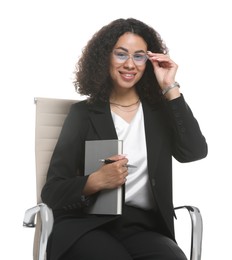 Photo of Professional psychologist with notebook and pen in office chair on white background
