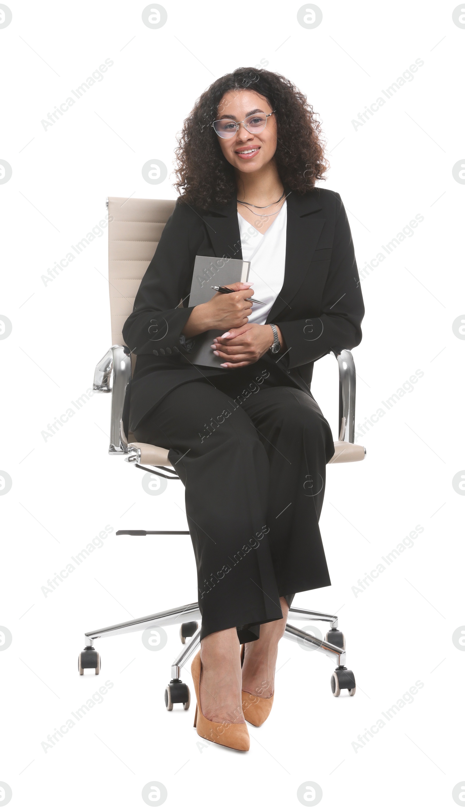 Professional psychologist with notebook and pen in office chair on white background Photo of Professional psychologist with notebook and pen in office chair on white background