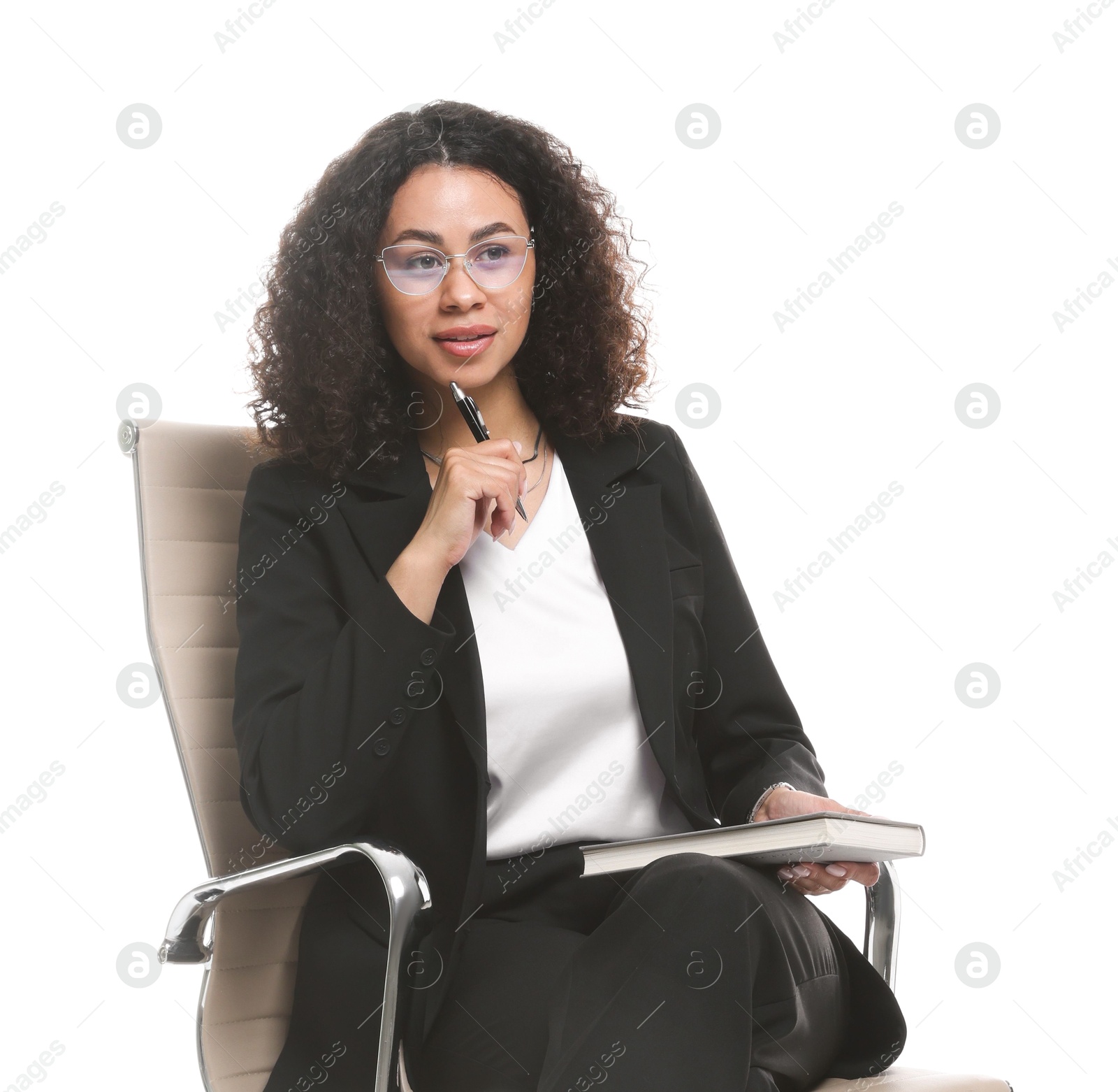 Professional psychologist with notebook and pen in office chair on white background Photo of Professional psychologist with notebook and pen in office chair on white background