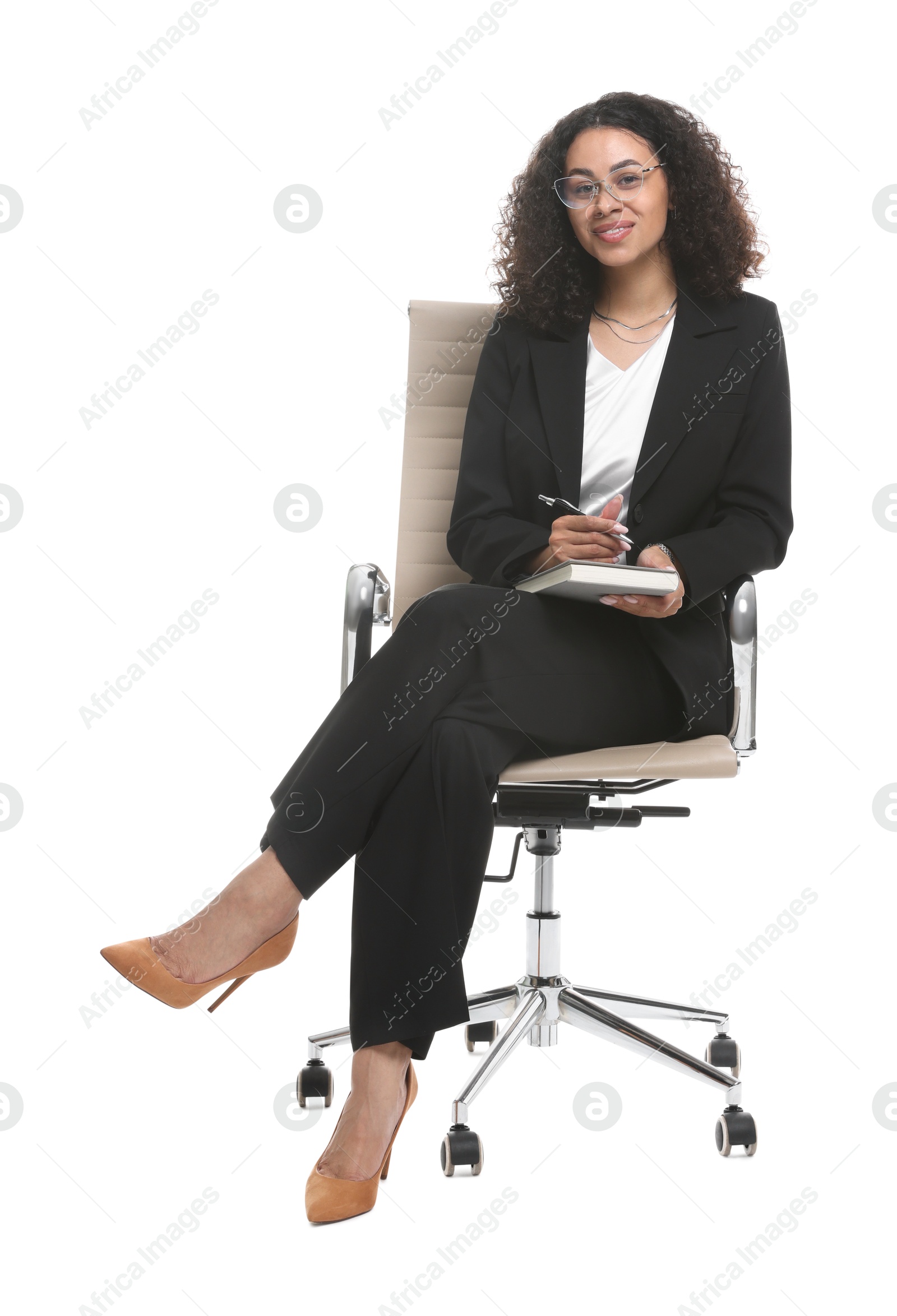 Professional psychologist with notebook and pen in office chair on white background Photo of Professional psychologist with notebook and pen in office chair on white background