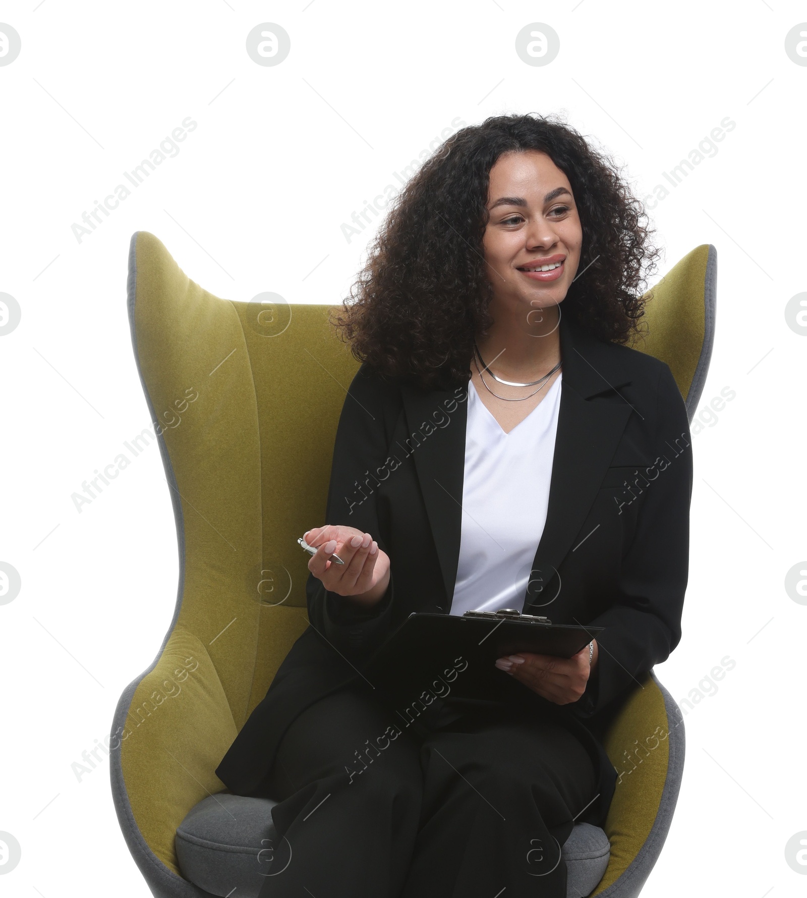 Professional psychologist with clipboard and pen in armchair on white background Photo of Professional psychologist with clipboard and pen in armchair on white background