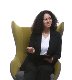 Photo of Professional psychologist with clipboard and pen in armchair on white background