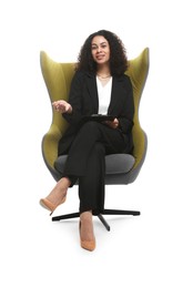 Photo of Professional psychologist with clipboard and pen in armchair on white background