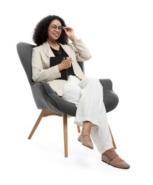 Photo of Professional psychologist with notebook and pen in armchair on white background