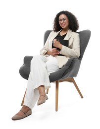 Photo of Professional psychologist with notebook and pen in armchair on white background