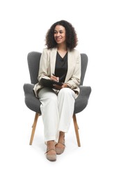 Photo of Professional psychologist with clipboard and pen in armchair on white background