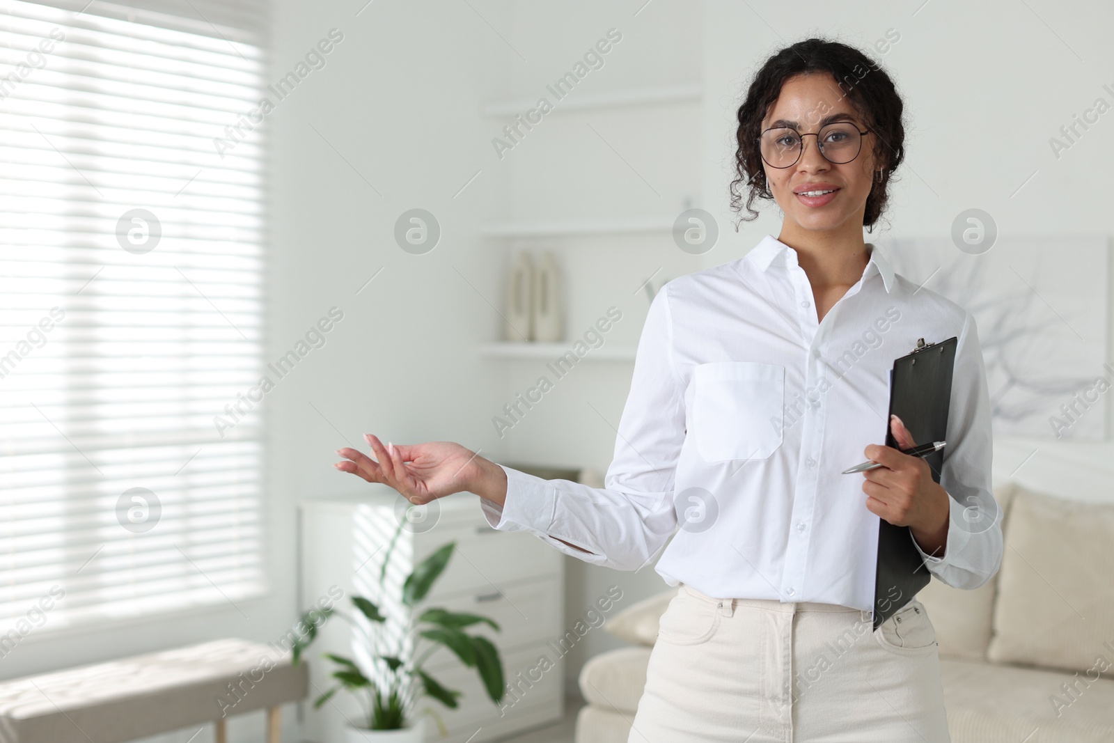 Professional psychologist with clipboard and pen in office Photo of Professional psychologist with clipboard and pen in office
