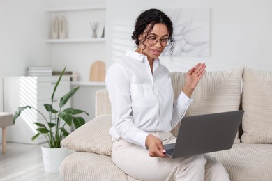 Photo of Professional psychologist working with laptop in office