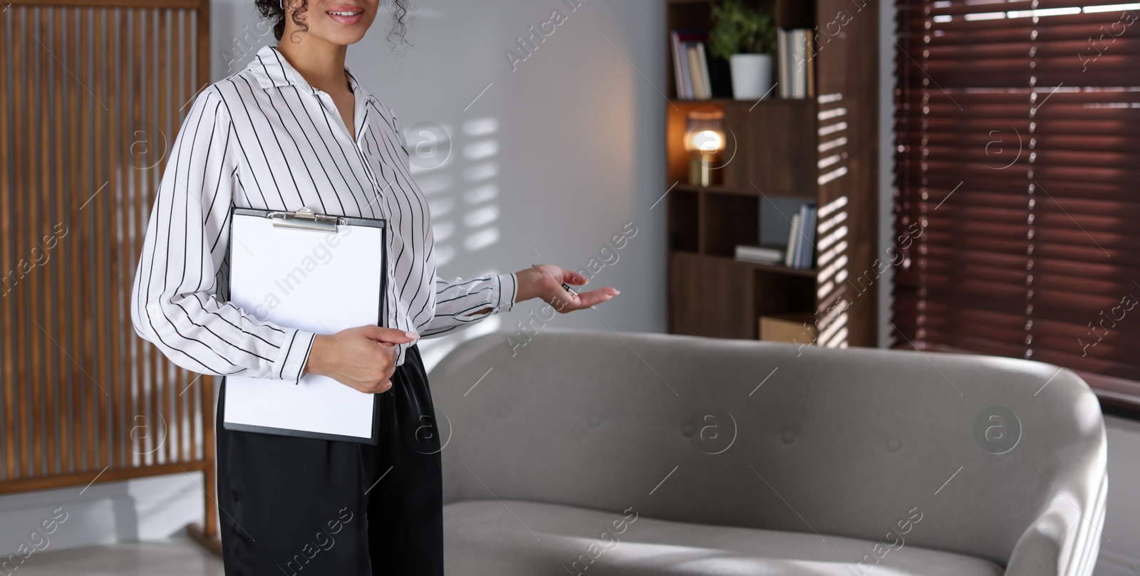 Professional psychologist with clipboard in office, closeup. Space for text Photo of Professional psychologist with clipboard in office, closeup. Space for text
