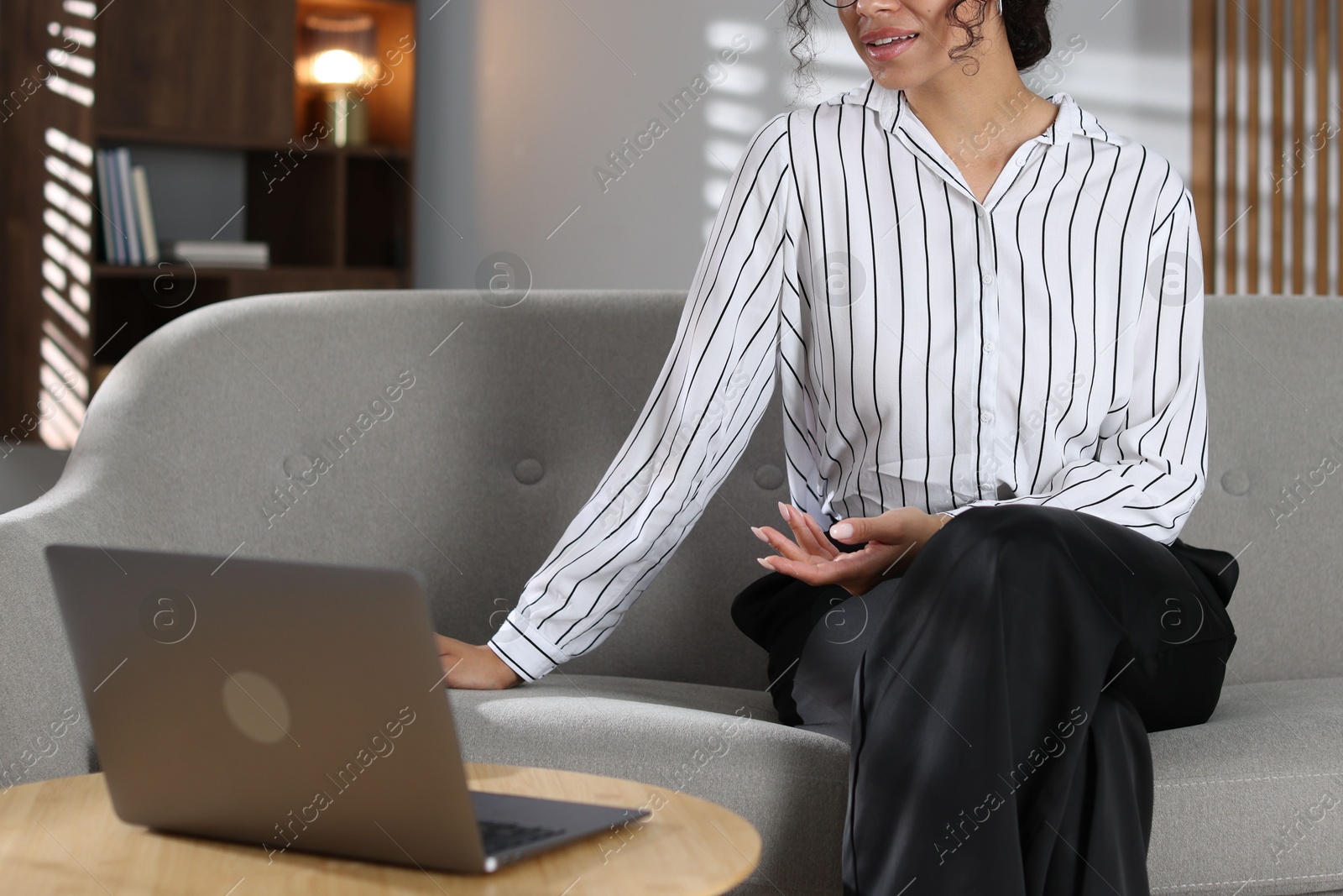 Photo of Professional psychologist working with laptop in office, closeup