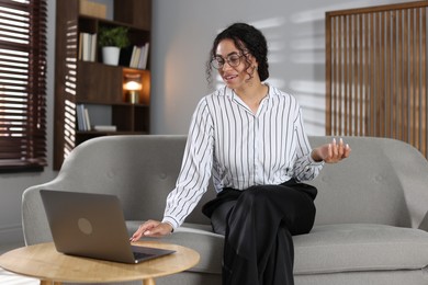 Photo of Professional psychologist working with laptop in office