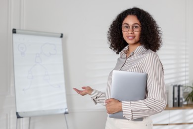 Photo of Portrait of professional psychologist with laptop in office