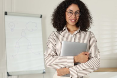 Photo of Portrait of professional psychologist with laptop in office
