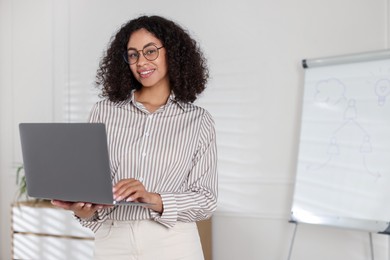 Photo of Portrait of professional psychologist with laptop in office, space for text