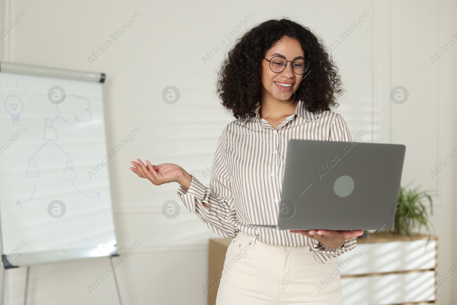 Professional psychologist working with laptop in office Photo of Professional psychologist working with laptop in office