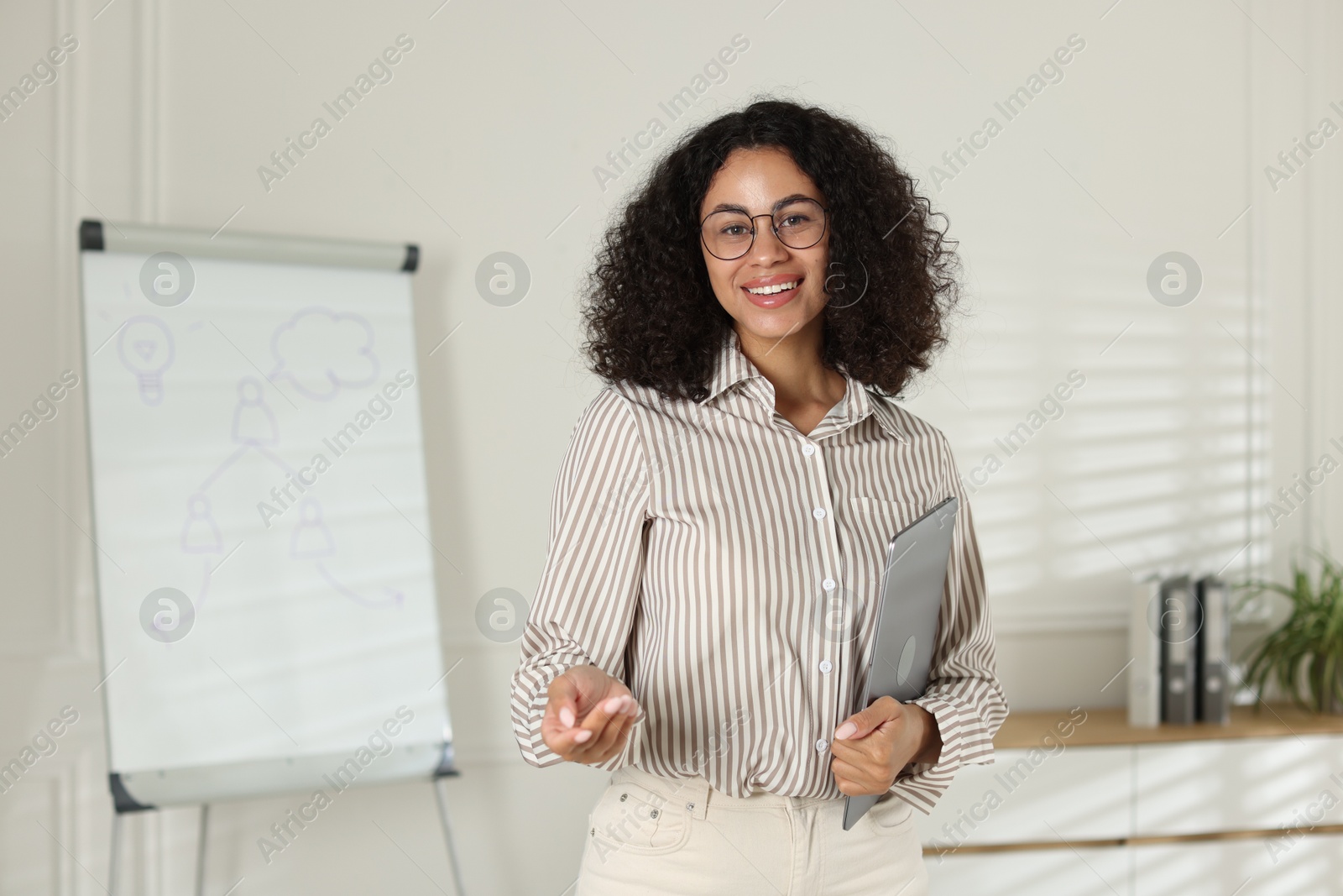 Portrait of professional psychologist with laptop in office Photo of Portrait of professional psychologist with laptop in office