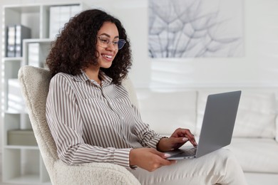 Photo of Professional psychologist working with laptop in office