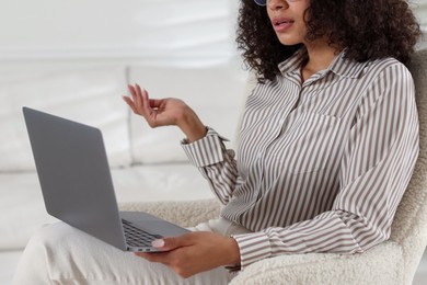 Photo of Professional psychologist working with laptop in office, closeup