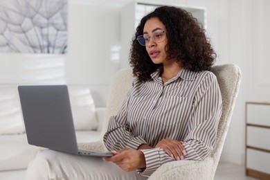 Photo of Professional psychologist working with laptop in office