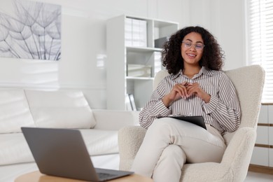 Photo of Professional psychologist working with laptop in office
