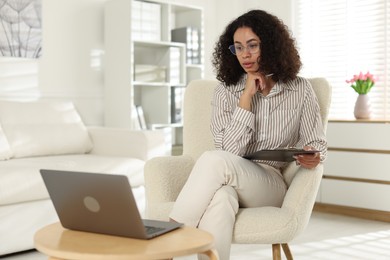 Photo of Professional psychologist working with laptop in office