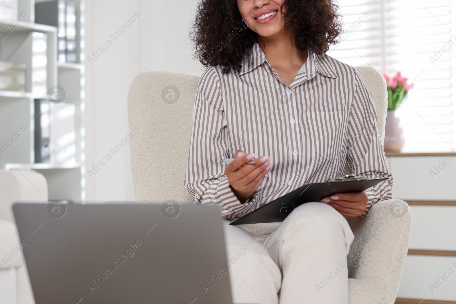 Professional psychologist working with laptop in office, closeup Photo of Professional psychologist working with laptop in office, closeup