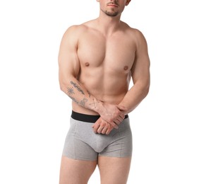 Photo of Young man in stylish light grey underwear on white background, closeup