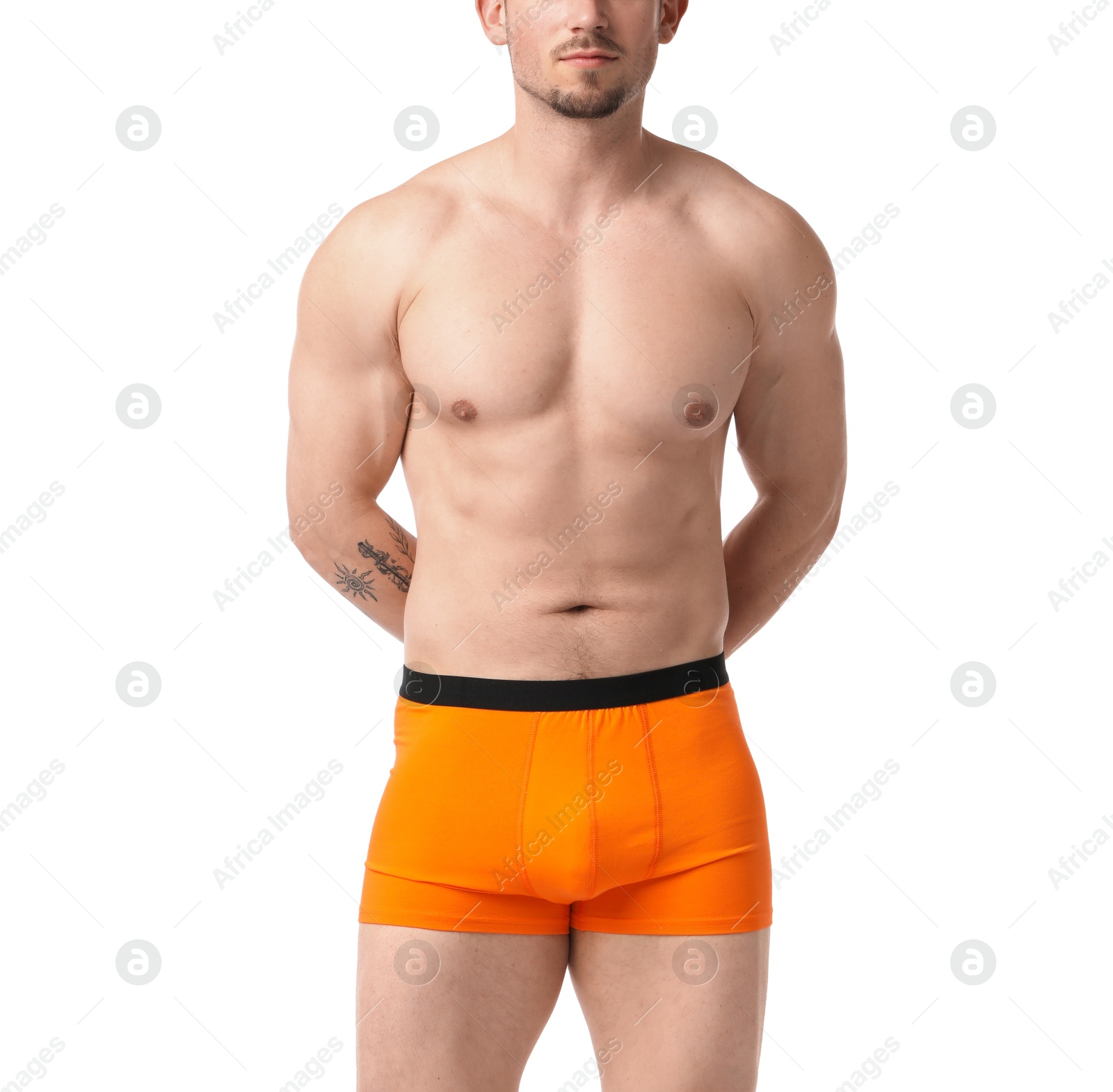Young man in stylish orange underwear on white background, closeup Photo of Young man in stylish orange underwear on white background, closeup