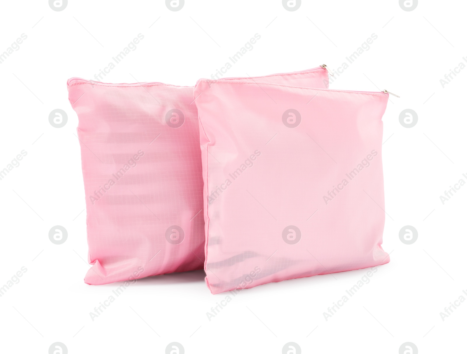 Photo of Pink packing bags isolated on white. Storage organizer