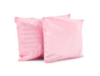 Photo of Pink packing bags isolated on white. Storage organizer