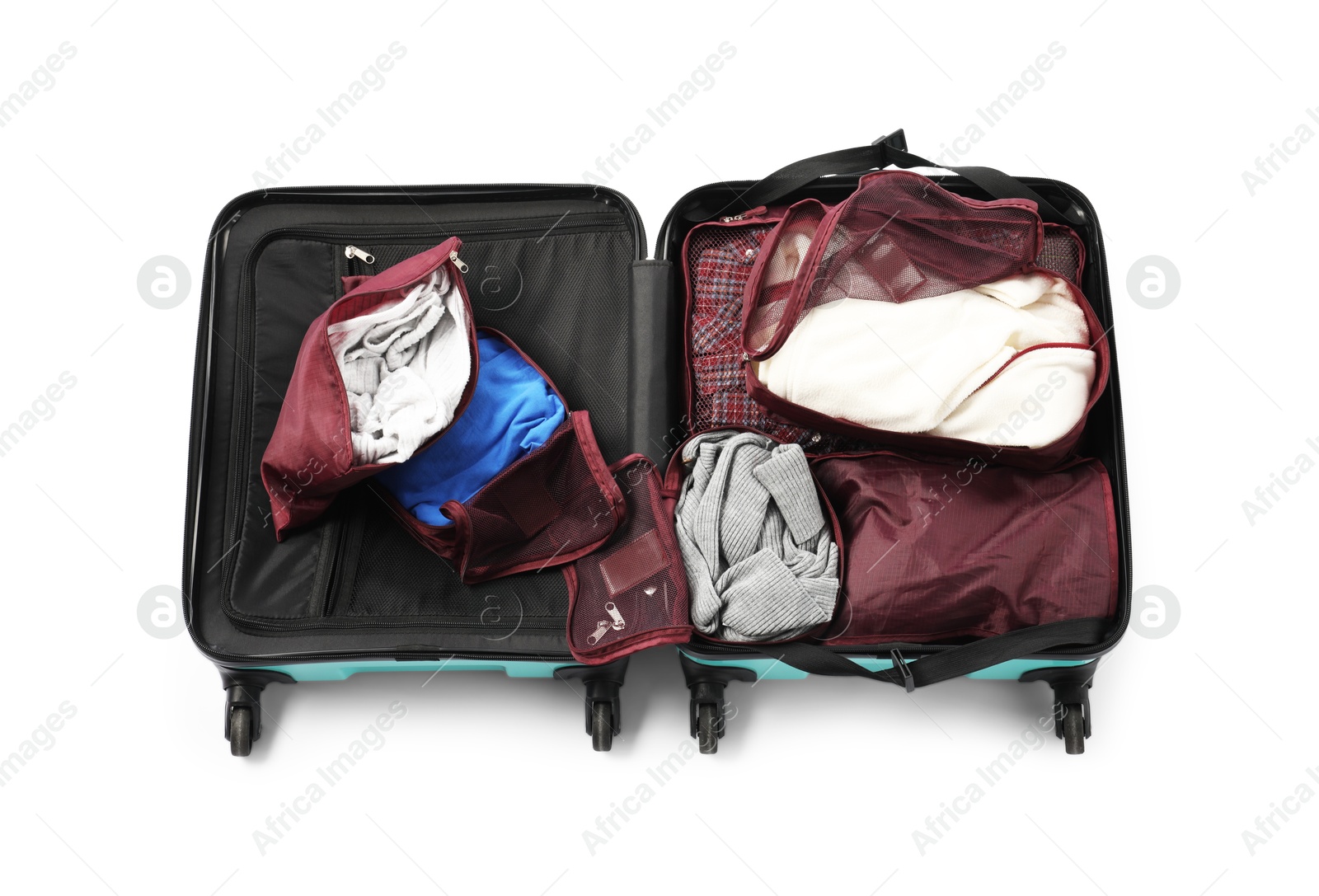 Open suitcase with packing cubes isolated on white, top view Photo of Open suitcase with packing cubes isolated on white, top view