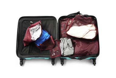 Photo of Open suitcase with packing cubes isolated on white, top view