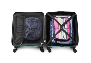 Photo of Open suitcase with packing cubes isolated on white, top view