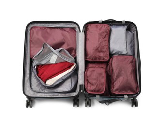 Photo of Open suitcase with packing cubes isolated on white, top view