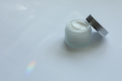 Photo of Jar of body cream on white background, space for text
