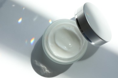 Photo of Jar of body cream on white background, top view