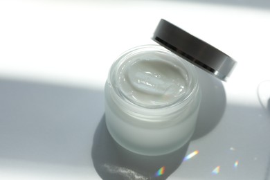 Photo of Jar of body cream on white background, closeup