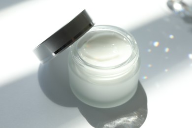 Photo of Jar of body cream on white background, closeup