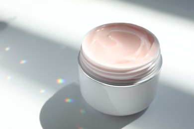 Photo of Jar of body cream on white background, closeup