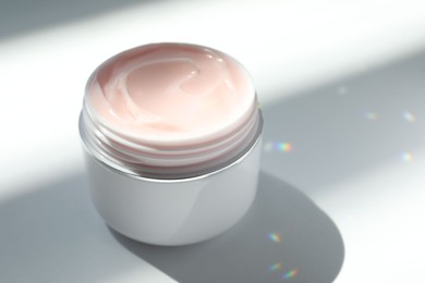 Photo of Jar of body cream on white background, closeup