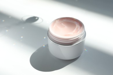 Photo of Jar of body cream on white background, closeup