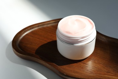 Photo of Jar of body cream on white background, closeup