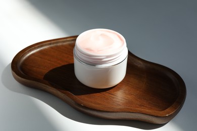 Photo of Jar of body cream on white background, closeup