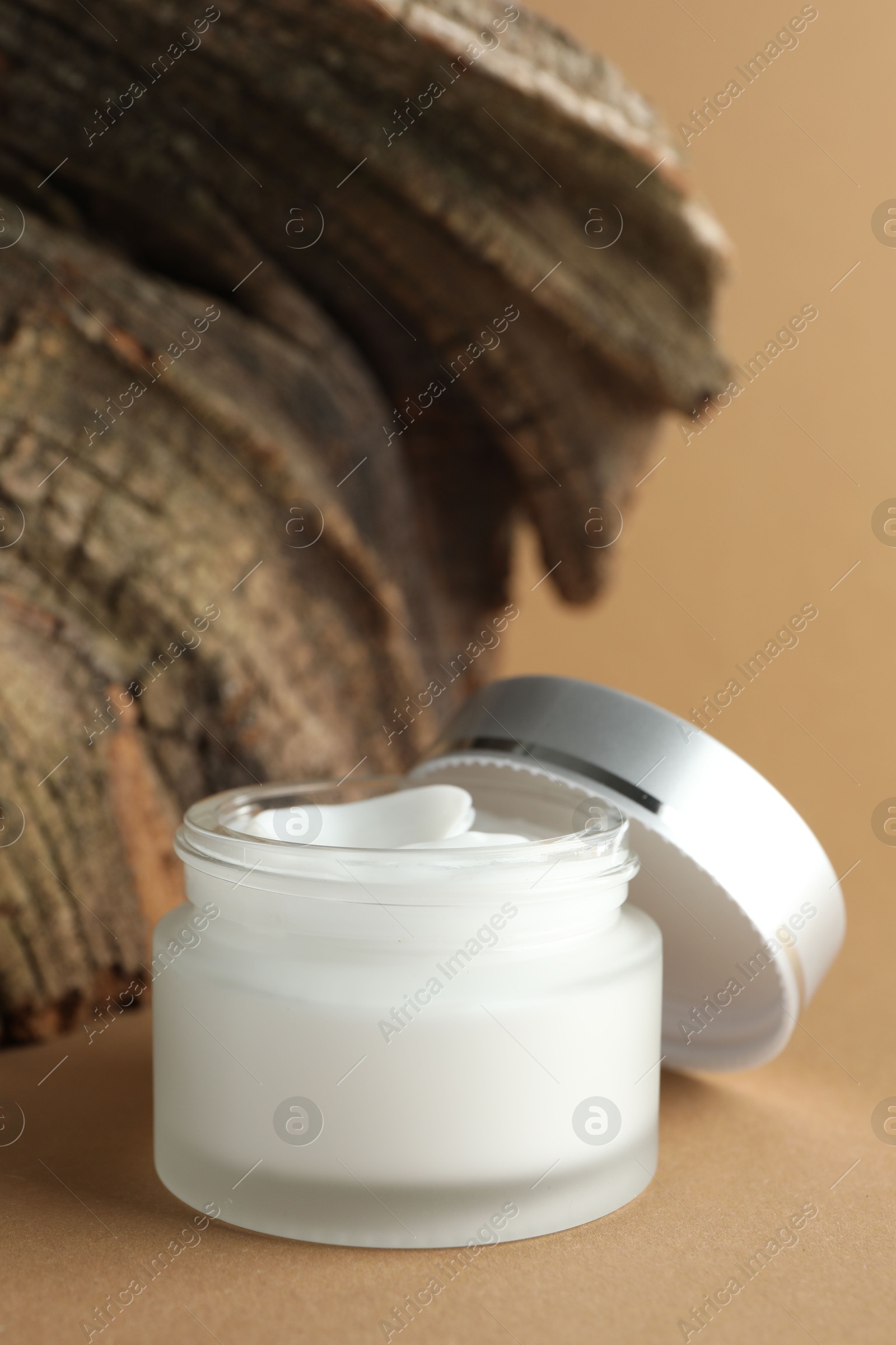 Jar of body cream on beige background, closeup Photo of Jar of body cream on beige background, closeup