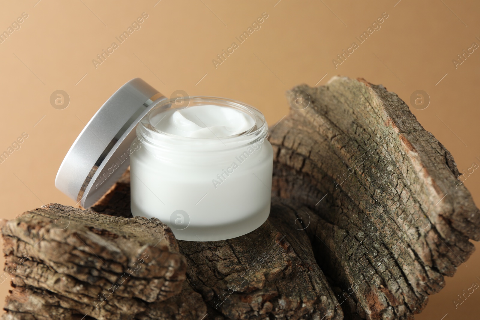 Jar of body cream on beige background, closeup Photo of Jar of body cream on beige background, closeup