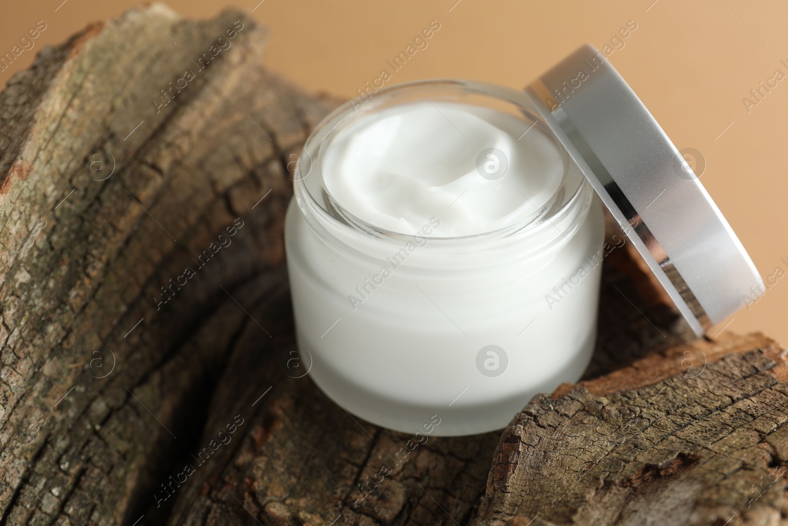 Jar of body cream on beige background, closeup Photo of Jar of body cream on beige background, closeup