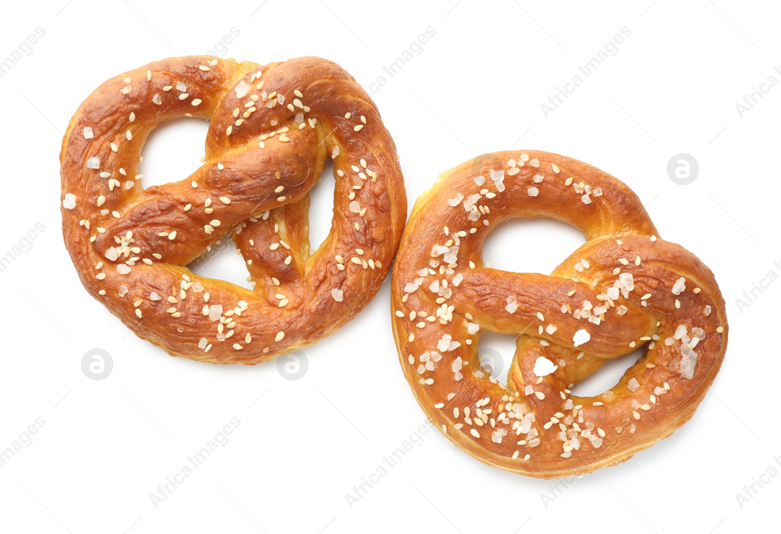 Tasty pretzels with salt isolated on white, top view Photo of Tasty pretzels with salt isolated on white, top view