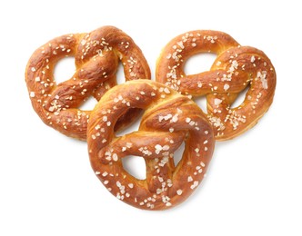Photo of Tasty pretzels with salt isolated on white, top view