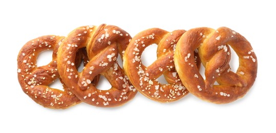 Photo of Tasty pretzels with salt isolated on white, top view